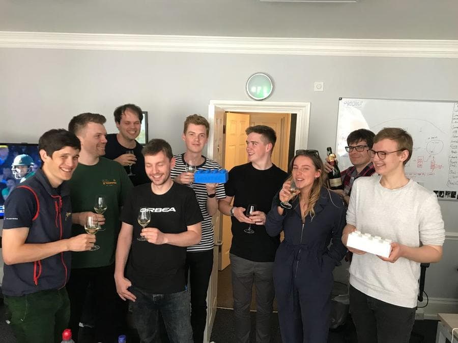 The Percent team celebrating an award from Atlassian.